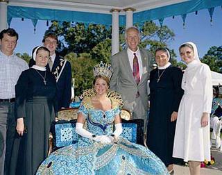 Texas Rose Festival in Tyler Texas. At the Queen's Tea: The Queen Lauren French Sanford and her escort Zachary Edward Lee Willens, posing with nuns. Behind Lauren her father Fagg Sanford III.
